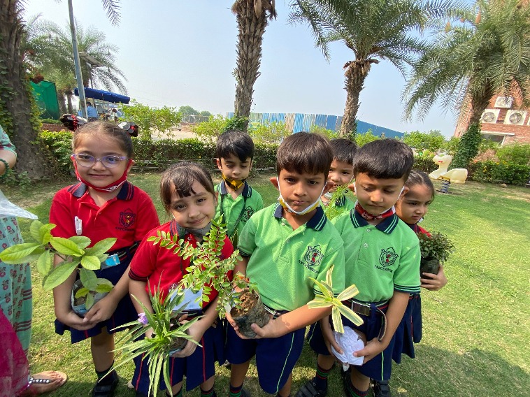 Students joyfully plant saplings at DPS RNE’s Tree Plantation Drive